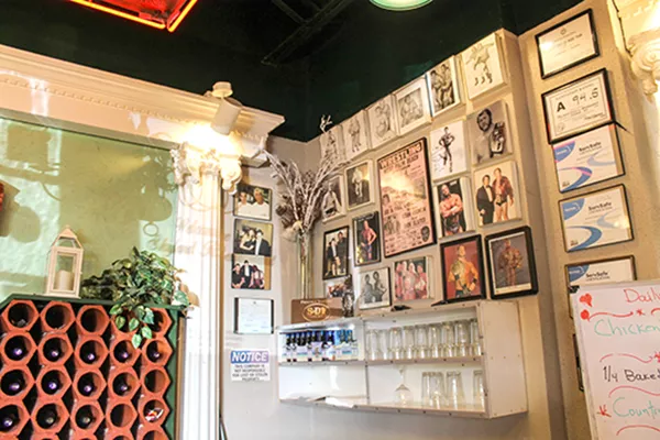 A portion of the wall in Skyland pays homage to old-school professional wrestlers, a passion of Jimmy’s. (Photo by Alexandria Sands)