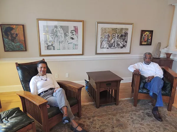 The Diamonds in their living room, where the first piece they acquired in America, Romare Bearden’s “Brass Section,” hangs (second from right).