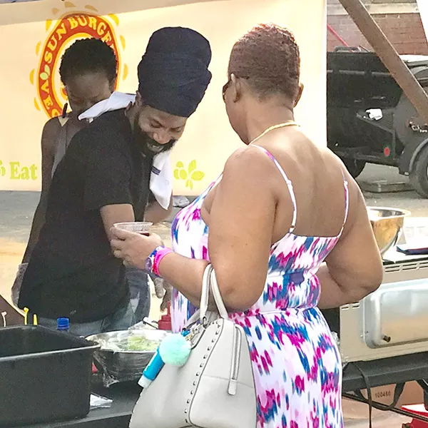 Stephens (in black turban) prepares ital cuisine at the Bla/Alt Fest.