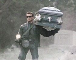 ROBERT ZUCKERMAN/WARNER - UNDERTAKER BUSINESS It's a grave situation for - Arnold Schwarzenegger in Terminator 3: Rise of - the Machines -  -