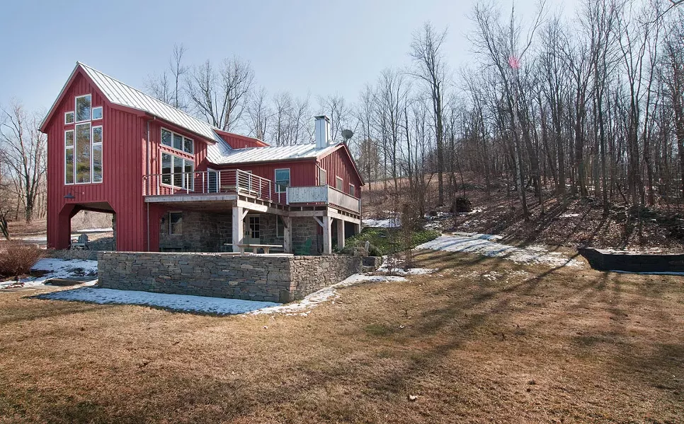 A glassy saltbox transformed from a weekend retreat to a country home through. - DEBORAH DEGRAFFENREID
