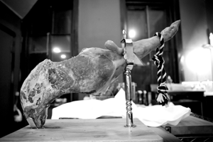A leg of jamon serrano on a jamonera in the kitchen at Elephant - AMBER S. CLARK