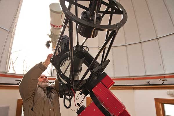Bob Antol adjusting his Ritchey-Chrétien telescope. - DEBORAH DEGRAFFENREID