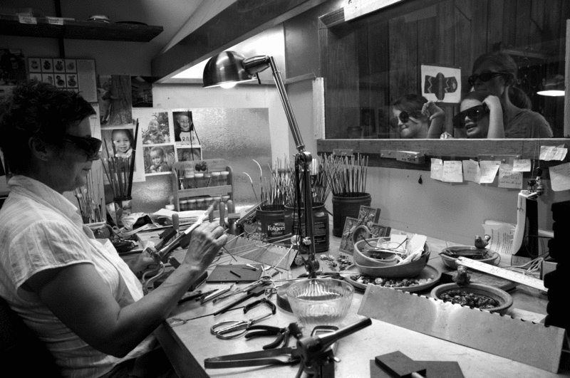 Carol Markytan of the Artists’ Shops at 175 Jay Street does lampworking for a captive audience. - HILLARY HARVEY