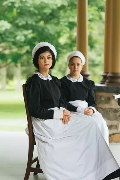 Cheyenne and Chelsie await their next group at Historic Huguenot Street, where they give tours. - THOMAS SMITH