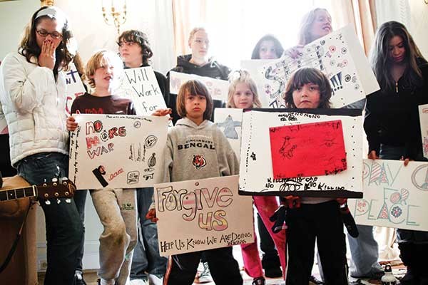 Children delivering messages of peace to the - Afghanistan Embassy in Washington, DC, on December 29, 2008. - SCOTT LANGLEY
