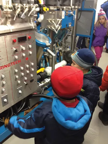 Children ogling the industrial-sized, state-of-the-art reverse osmosis machine at - Madava Farms, home of Crown Maple syrup, in Dover Plains.