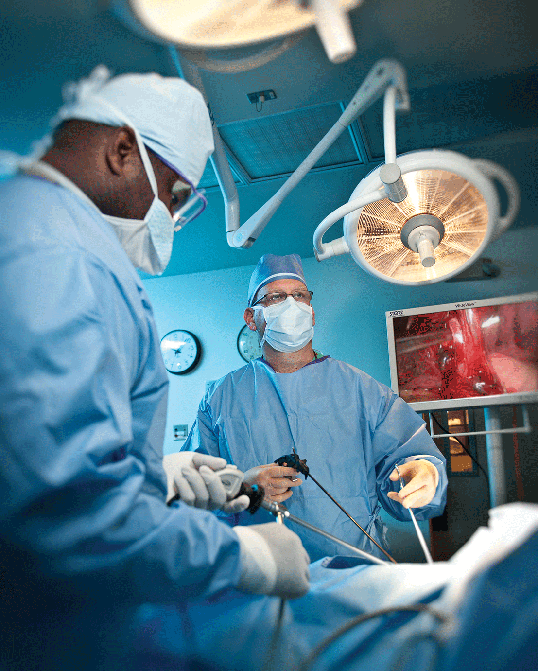 Dr. Darren Rohan, the chief of thoracic surgery, and co-chair of the department of general surgery for HealthAlliance of the Hudson Valley, performs a thoracoscopic lobectomy with the assistance of surgical technician Rob Wilson while watching on the operating room’s flat-screen high-definition monitor. - DON DEMPSEY, WHITE LIGHT LLC