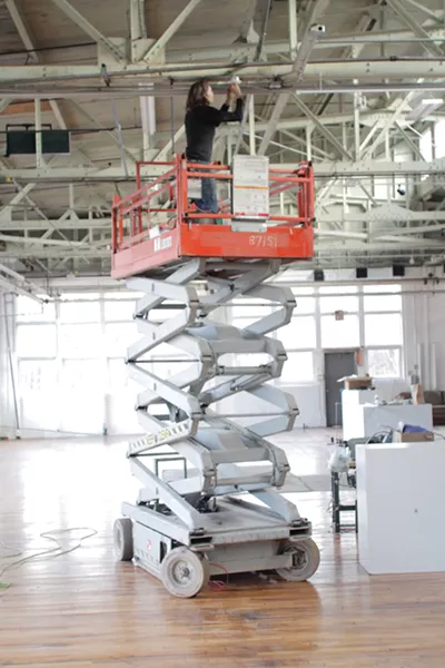 Erica Price installing lights at SPAF. - MATT KEHOE