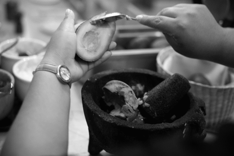 Guacamole is made fresh tableside with a mortar and pestle at La Puerta Azul. - JENNIFER MAY