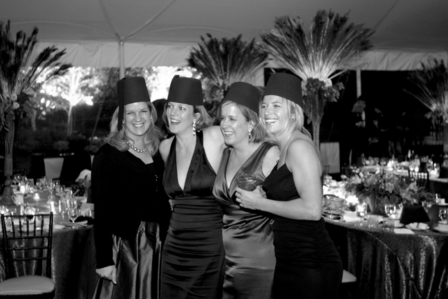Guests pose in traditional Moroccan fezzes at the Keeler-Hord wedding. Image courtesy of Renzi & Hawkens Studio. All rights reserved.
