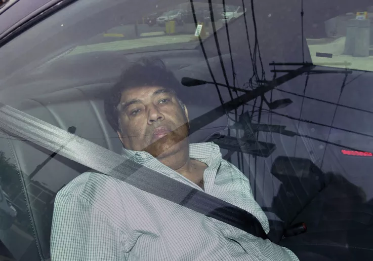 Hemant Lakhani is driven by FBI agents into the Federal Courthouse in Newark, New Jersey on August 13, 2003. lakhani was convicted of providing material support to terrorists and illegal weapons dealing after being ensnared in a government sting operation, and is serving a 30-year prison sentence.