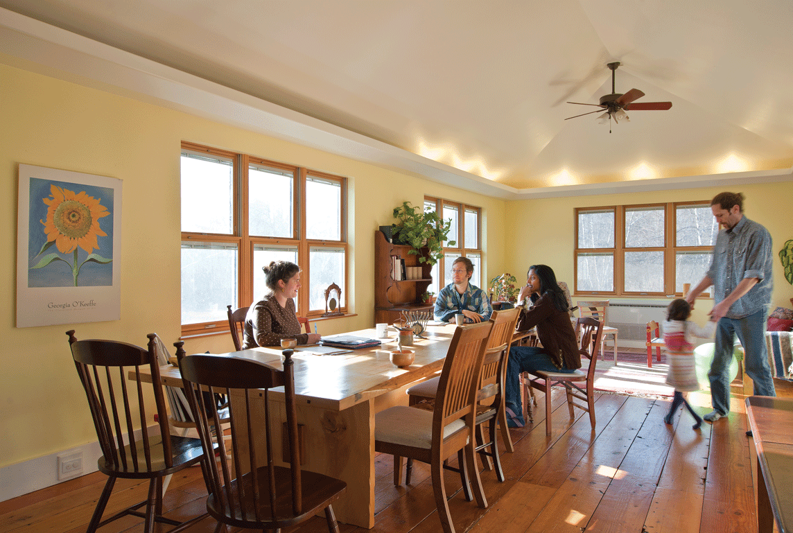 Jeff Golden and Samiha Golden dancing while Kavitha Rao, Johanna Greenberg, and - Stephen Switzer enjoy the morning sun and conversation in the dining room at Common Fire. - DEBORAH DEGRAFFENREID