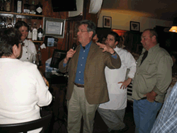 Jessica Winchell (behind bar), chef/owner of the Global Palate in West Park, Chef Richard Virgili of the Culinary Institute (with microphone), Chef Mike Bernardo of the Global Palate, and "Potato Bob" Kiley of RSK Farm (far right) at a benefit for RSK Farm on November 6 at Global Palate. RSK Farm in Prattsville was wiped out when the Schoharie Creek flooded post Irene and swept much of the farm's topsoil away. The event raised $8,000 for RSK FarmPhoto by Deirdre Smith.