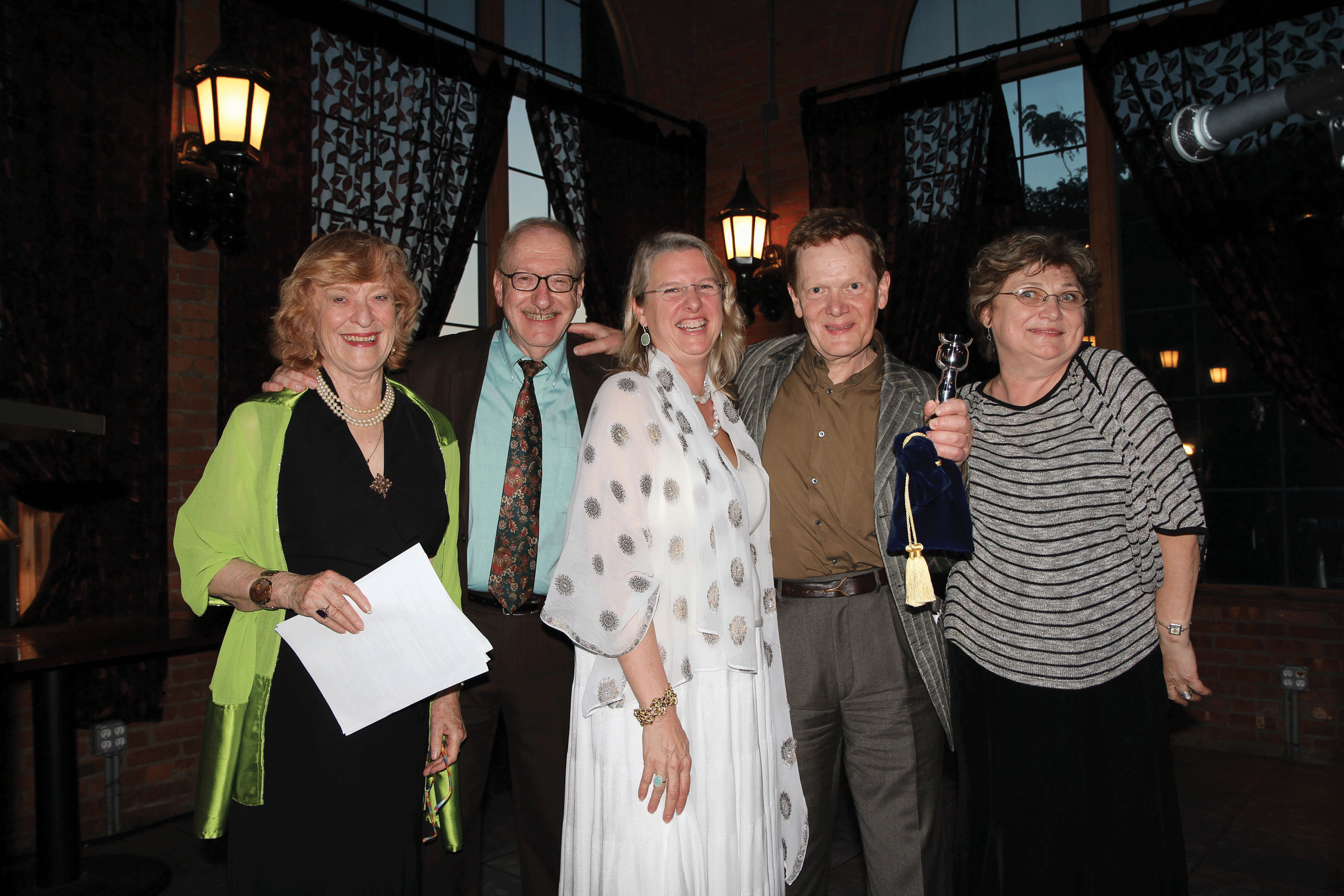 Members of the Arts Society of Kingston board of directors posing with aerialist and author Philippe Petit, who was honored along with composer Peter Schickele and painter Jane Bloodgood Abrams at ASK’s Havin’ a Ball benefit at the Steel House in Kingston. - JIM RICE