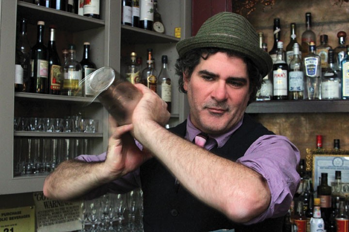 Paul Maloney, owner/master mixologist at the Stockade Tavern, behind the bar. “You can’t be shy with the shaking,” says Maloney.