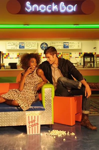 Popcorn Players: Saadah Garbey wearing a 1960s/1970s Siam Boutique brown bird-pattern dress. Benjamin Fiege wearing a 1970s brown plaid shirt and 1980s Christian Dior black jacket. Make up by Saadah Garbey. From Blackbird Attic. - KELLY MERCHANT