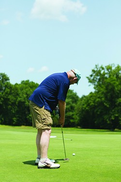Russ Chapman putts for birdie on the New Paltz Public Golf Course. - THOMAS SMITH