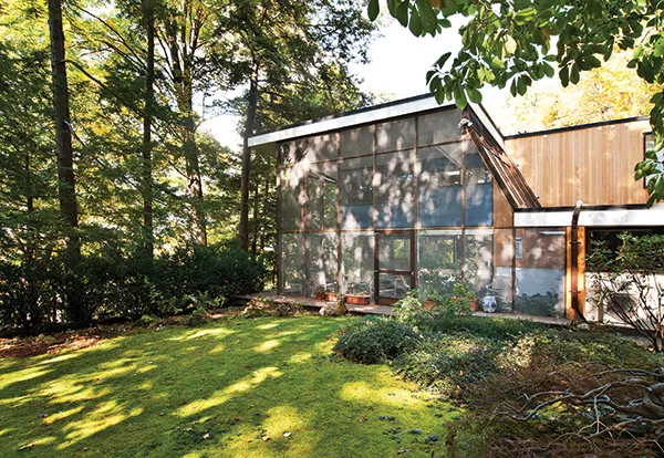 Screened-in porch at the south end of the house constructed by Arthur Groten and his nephews in 1983. - DEBORAH DEGRAFFENREID