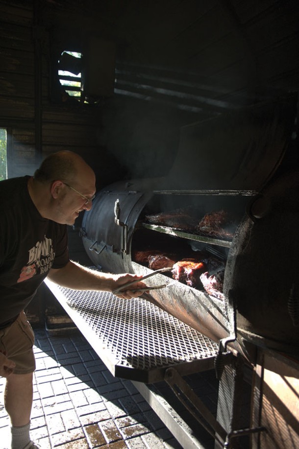 Smoking meat in the smokehouse. - ROY GUMPEL