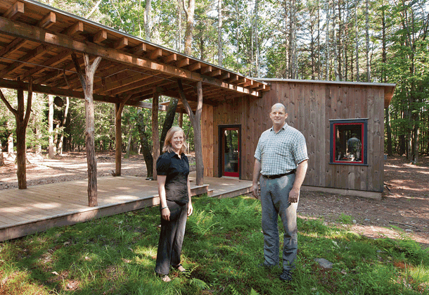 Stephanie Bassler and Peter Reynolds of North River Architecture & Planning in front of the studio at the Woodstock area house they designed. - DEBORAH DEGRAFFENREID