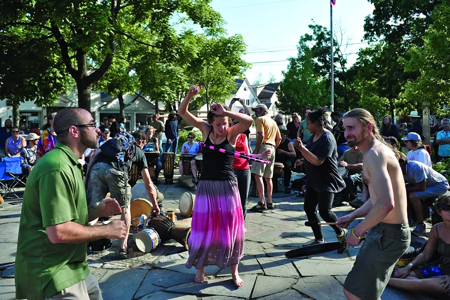 Sunday afternoon drum circle on the green in Woodstock. - DAVID MORRIS CUNNINGHAM