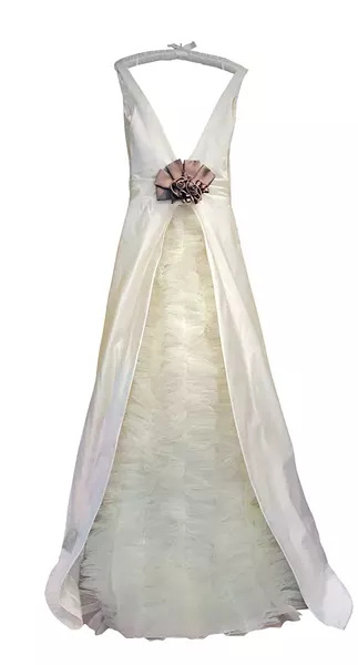 The back view of a custom-made gown in ruched silk taffeta with a bustle of gathered tulle, and embellished with a custom-made silk flower “bling” at waistline, by designer Barbara Kerner of Style des Reves Custom Dressmaking in Accord.
