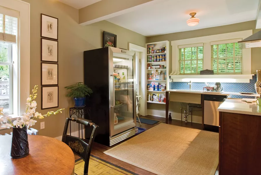 The eat-in kitchen is used to maximum efficiency with a minimum of storage space and stainless-steel appliances. - DEBORAH DEGRAFFENREID