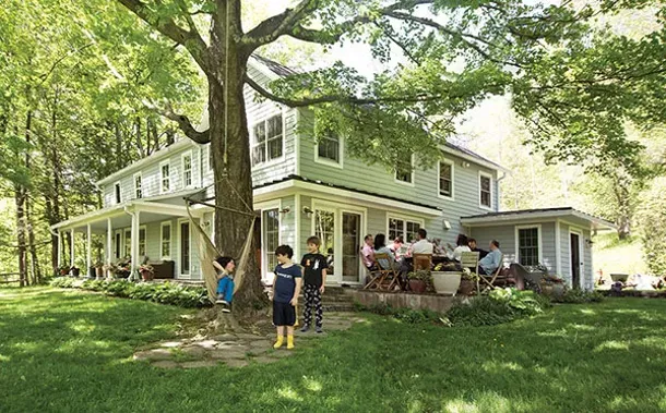 The 1775 Colonial is surrounded by a grove of mature oaks and giant sugar maples. "It's wild to think the house is older than the trees," says Leonard. "We finally tapped the sugar maples for the first time this past spring."