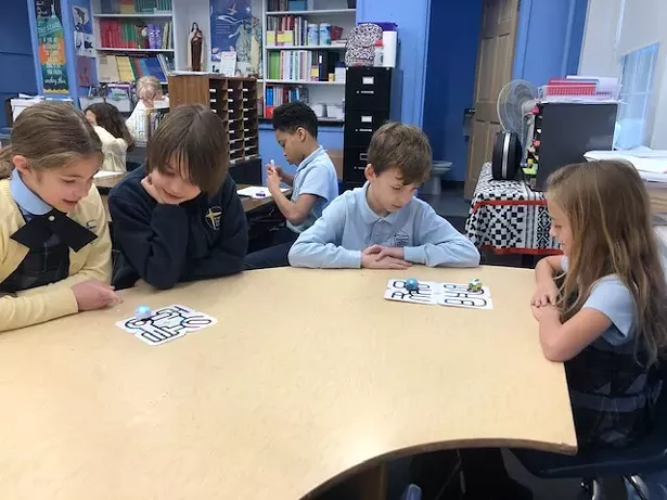Third-graders at Kingston Catholic School using Ozobots to learn basic coding.