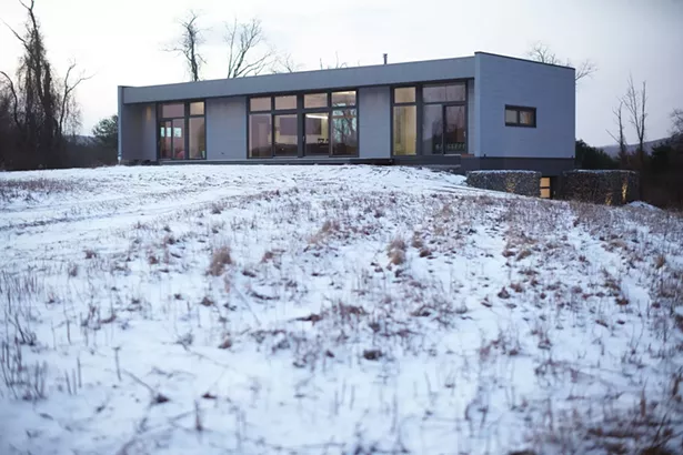 CATAMOUNT HOUSE, Hillsdale, NY - This 1680 square foot house is built using the CLT (Cross Laminated Timber) log wall system that combines ancient and modern technologies to create energy efficient exterior enclosure. The structure is perched on a crest of the small knoll and surrounded with undulating horizon of distant hills and overlooking Catamount Ski Resort. - SCOTT BENEDICT