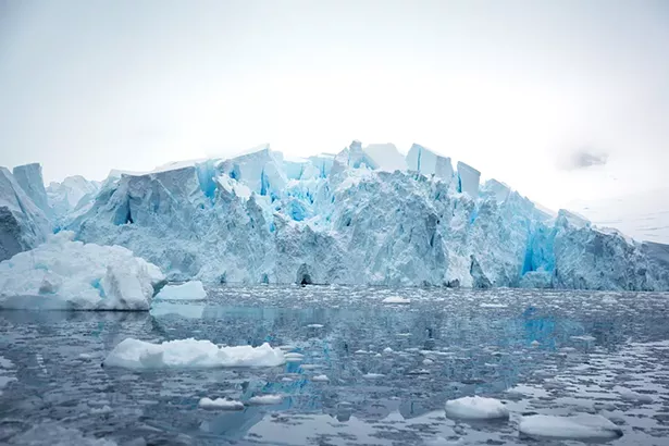 The blue hue marks the age of the ice—created from decades of snowfall and enormous amounts of pressure that squeeze out all the air bubbles to form an incredibly dense and brilliantly blue frozen mass. - PHOTO BY MADELINE COTTINGHAM