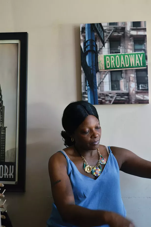 Strong Women of Newburgh 2018 series: Sha is preparing before a days work at her salon on lower Broadway. - PHOTO BY THERESE FISCHER