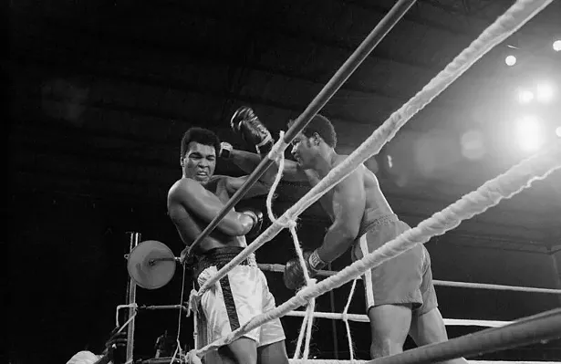Heavyweight champion George Foreman (r) and Muhammad Ali (l) exchange punches during their world heavyweight title boxing match in 1974. - PUBLIC DOMAIN VIA FLICKR