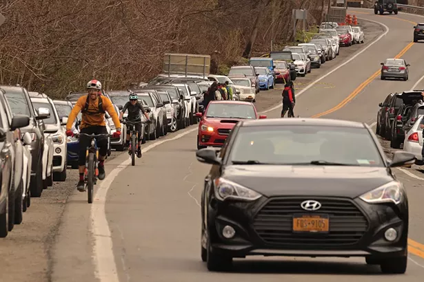 Cars lined up along Route 9D near the trailhead for Breakneck Ridge in early April. What happened to social distancing everybody? - PHOTO BY ROSS CORSAIR