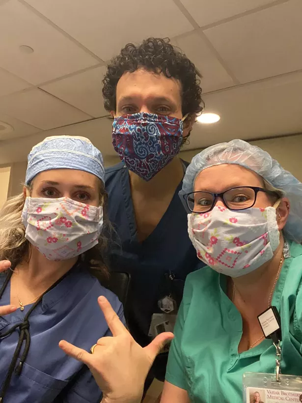 Nurses Rebecca Blackwell-Hafner, Daniel Frisina, and Julie Forgit at Vassar Brothers Medical Center, - wearing masks made by Karina - Cousineau and volunteer sewers.