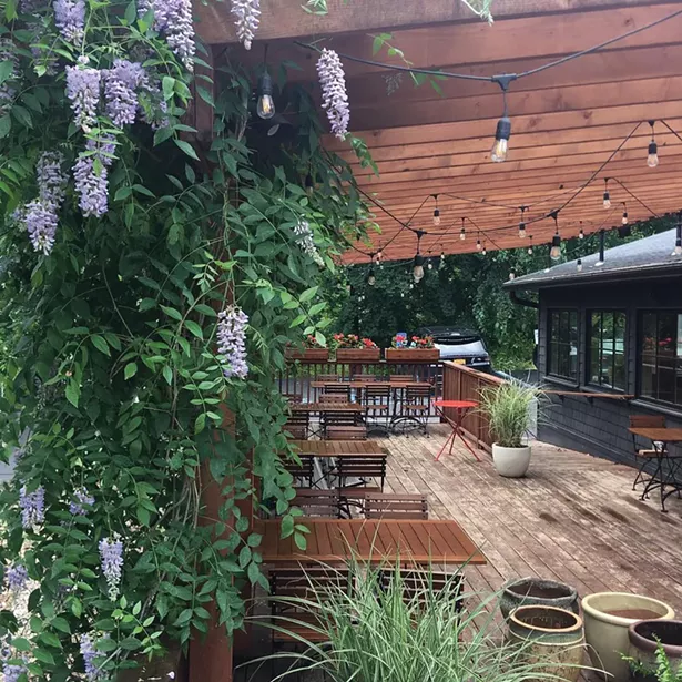 Outdoor dining on the porch at Silvia.