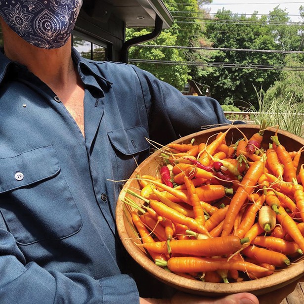 Carrot thinnings from Great Song Farm to be served with Silvia’s wood-smoked and brined chicken.