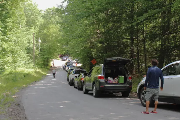 A queue of cars on July 12 waiting for parking spaces to open up at the Laurel House lot, the closest parking area to Kaaterskill Falls. - PHOTO BY ROGER HANNIGAN GILSON