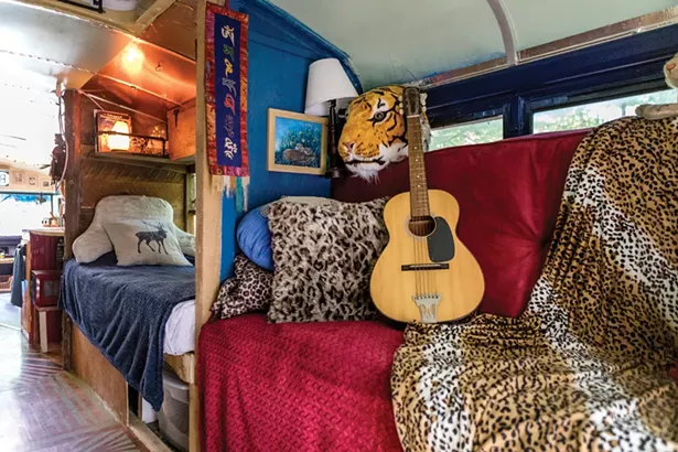 Snyder used some of her quarantine time to rework the bus’s back half. What was once her bedroom is now an art studio and lounge with a convertible sofa bed. As with the first iteration she primarily did the work herself. “Brigantia translated means lofty one,” she says. “It feels like you’re high up when you’re inside. Plus, there are all sorts of anagrams that come out of it, like giant and big. That’s what it feels like, even though it’s a tiny house. It feels big.” - PHOTO BY WINONA BARTON-BALLENTINE
