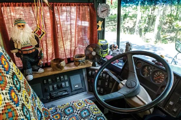The front seat of Julie Snyder’s bus, which she’s named Brigantia. The bus is drivable and Snyder has taken it all over the northeast. “It fits in exactly two parking spaces, end to end,” she explains. - PHOTO BY WINONA BARTON-BALLENTINE