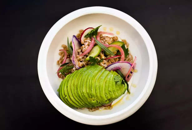 Grain bowl with farro, avocado, and radishes