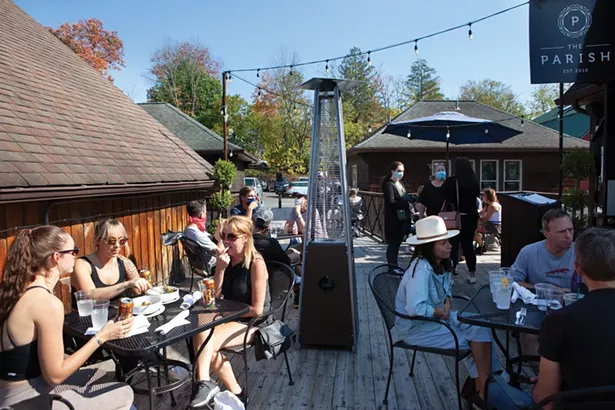 The deck of the Parish, a New Orleans-inspired - restaurant on the second story of Water Street Market, - has commanding views of the Shawangunk Ridge.