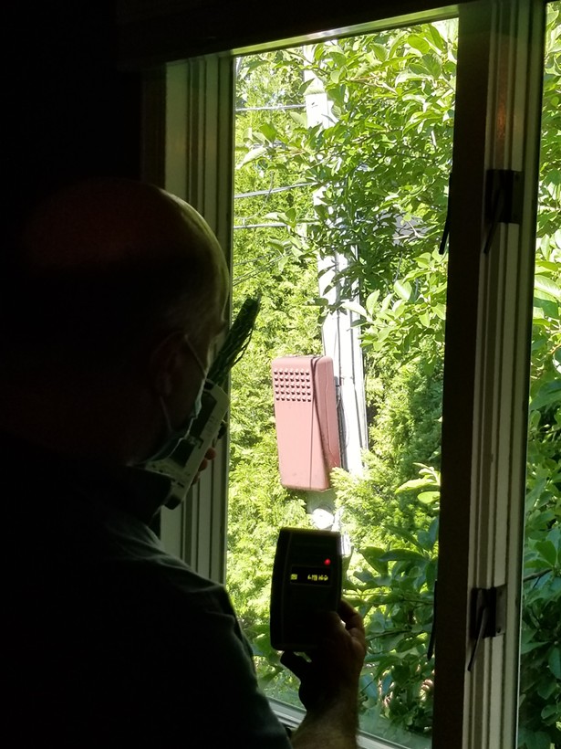 Measuring high radio frequency coming off of a 5G small cell just outside a client’s bedroom. - IMAGE COURTESY OF HARRISON BARRITT.