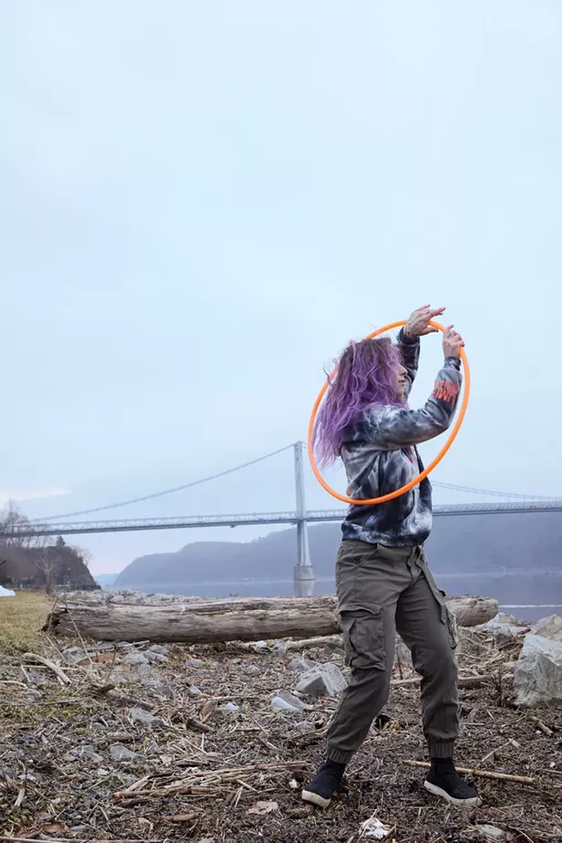 Dominique Manfrede is a hula hoop influencer (@hoopsy_domo) with a large following who practices daily at Upper Landing Park. - PHOTO BY DAVID MCINTYRE