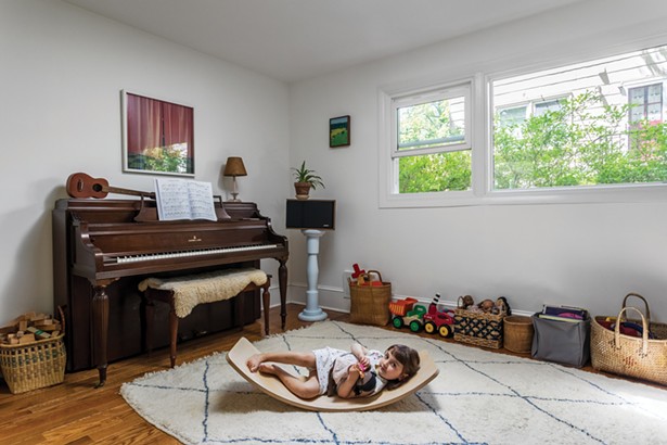 Winick and Bloomberg converted what was once a dental office reception area into a light-filled play nook. The area can be easily separated from the rest of the house with safety gates—allowing the children full ownership of the space. Above the piano, a close-up photo by Airyka Rockefeller of a shoe shelf in Vilnius, Lithuania. On the adjacent wall is a cyanotype by Nellie Appleby. - WINONA BARTON-BALLENTINE