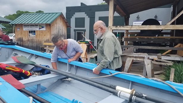 Jeanie Antonelle and Mike Sadowy inspect the John Magnus at the Hudson River Maritime Museum's Riverport Wooden Boat School.