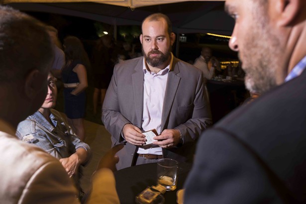 Norman Birenbaum, Director of Cannabis Programs at State of New York President of Cannabis Regulators Association, was in high demand at the event. - ROY GUMPEL