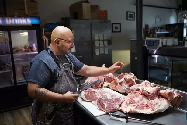 Stefano Diaz, owner and head butcher of the Meat Wagon, which opened in January of this year on Hasbrouck Avenue. - DAVID MCINTYRE