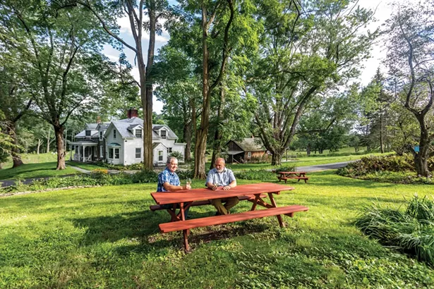 Brent Zimmerman and Alessandro Voglino bought Lime Kiln Farm in 2014 after rescuing and restoring two Tuscan farms. In the process, the two have found their skills complement one another nicely. “There’s so many things I have no clue what to do about,” says Zimmerman. “But Alessandro knows. Then there’s so many things he thinks there’s no way he could do, but it’s something I love to do.” Along with the old growth trees, the yard includes almost 170 peony plants. This past June the two hosted their first pop-up peony party. - WINONA BARTON-BALLENTINE